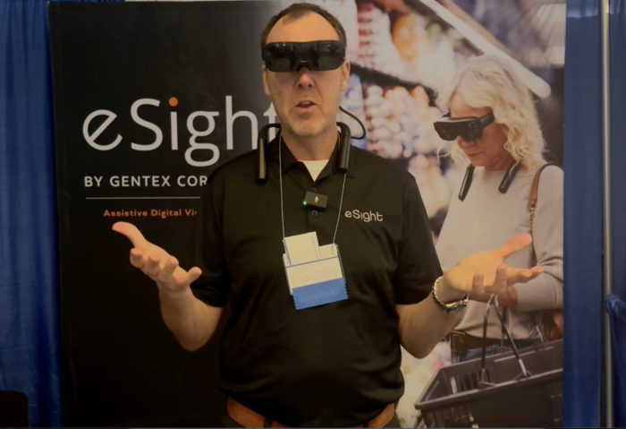 Roland Mattern, Director of Sales, at eSight showing eSight glasses
